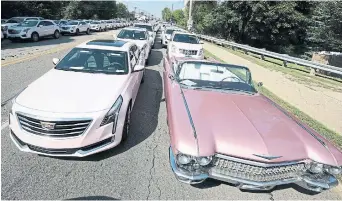  ?? AFP FILE PHOTO VIA GETTY IMAGES ?? Pink Cadillacs line Seven Mile Road in front of Aretha Franklin's funeral at the Greater Grace Temple in Detroit on Aug. 31, 2018.