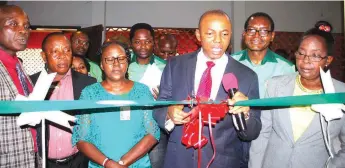  ??  ?? Pastor in charge of the Province, Amos Emovon cutting the tape with others