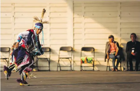  ?? JEFF McINTOSH, THE CANADIAN PRESS ?? An Indigenous dancer performs in the Elbow River Camp at the Calgary Stampede.