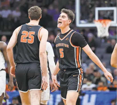  ?? KELLY L COX/USA TODAY SPORTS ?? Guard Jack Scott (5) celebrates with teammate Jacob O’Connell after Princeton defeated Missouri in the second round of the NCAA men’s tournament at Golden 1 Center.