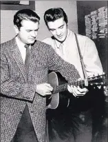  ?? COURTESY PHILLIPS
FAMILY ARCHIVES ?? Sam Phillips
and Elvis Presley on Dec. 4, 1956, when Presley dropped by Phillips’ studio and joined Johnny Cash, Carl Perkins
and Jerry Lee Lewis for a jam that would become known
as “The Million Dollar Quartet” session.