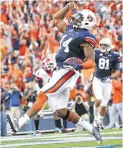  ?? AP PHOTO ?? Auburn quarterbac­k Nick Marshall leads a run-first offense that is averaging 320.3 yards per game rushing.