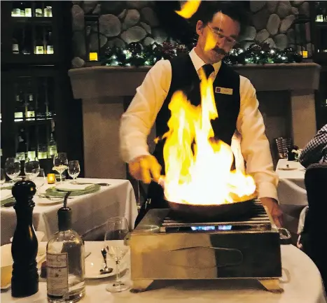  ?? PHOTOS: MIA STAINSBY ?? Gin-flamed tomato soup is made tableside at the Grill Room in Fairmont Chateau Whistler with local gin.