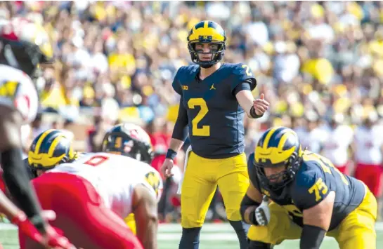  ?? AP ?? Shea Patterson’s mobility figures to be a key component for Michigan in its Big Ten showdown against Wisconsin, which has struggled to consistent­ly pressure quarterbac­ks.