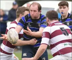  ??  ?? Tom Rowe delivers a pass in the seconds’ cup defeat to Tullow.