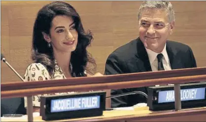  ?? POOL / GETTY ?? Amal y George Clooney, el martes, en una cumbre sobre refugiados, en las Naciones Unidas