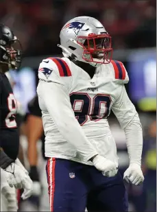  ?? Getty images ?? patriots defensive tackle christian barmore pumps his shoulders after making a tackle for a loss against the falcons on thursday night in atlanta, Ga.