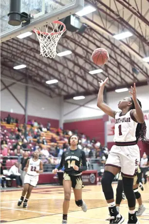  ?? Staff photo by Hunt Mercier ?? ■ Eliyah Howard of Liberty-Eylau's Lady Leopards makes a shot against Pleasant Grove's Lady Hawks on Tuesday at the Rader Dome in Texarkana, Texas. The Lady Hawks defeated the Lady Leopards, 57-47.