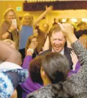  ?? JEN RYNDA/ BALTIMORE SUN MEDIA GROUP ?? County Executive Democratic candidate Steuart Pittman celebrates his win with supporters at Michael’s Eighth Avenue.