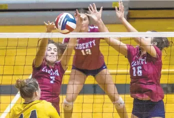  ?? APRIL GAMIZ/THE MORNING CALL ?? Liberty’s Autumn Marerro (7), blocks the ball with Sydney Houchens (16) against Freedom on Wednesday at Freedom High School.