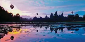  ?? — DAVID SIM/ Wikimedia Commons ?? Sunrise at the Angkor Wat Temple in Siem Reap, Cambodia.