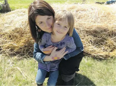  ??  ?? Adrienne Percy poses for a photo with her daughter Hannah on their farm in Fraserwood, Man. While some homesteade­rs start out small,
Percy and her family took on a 130-hectare farm.