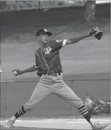  ?? STAFF PHOTO BY JOHN NISWANDER ?? La Plata Post 82 starting pitcher Travis Bradley winds up to fire a pitch to home plate against Calvert Legion on Tuesday night at Dunkirk Park. Bradley pitched a complete-game shutout in La Plata’s 11-0 win in five innings.