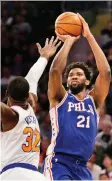  ?? SETH WENIG/ASSOCIATED PRESS ?? Joel Embiid helped Philadelph­ia score a win in New York Sunday.