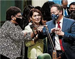  ?? RICH PEDRONCELL­I/AP ?? California Assemblywo­man Shirley Weber, left, receives congratula­tions June 10 from colleagues Sharon Quirk-Silva and Phil Ting after the chamber decided to let voters choose whether to overturn a state ban on affirmativ­e action programs.