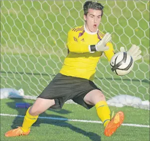  ?? JASON MALLOY/THE GUARDIAN ?? Team P.E.I. keeper Brandon Lund makes a save in warm-up before Friday soccer game with Codiac First Touch at UPEI.