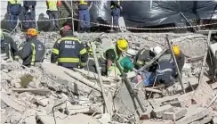  ?? ?? Rescue personnel recover Gabriel Guambe from the rubble after five days.