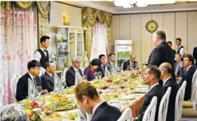  ?? AP PHOTO/MATTHEW LEE, POOL ?? Secretary of State Mike Pompeo, right, stands as he speaks during a dinner between North Korean dignitarie­s and U.S. diplomats Wednesday in Pyonyang, North Korea.