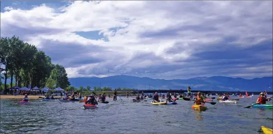  ??  ?? The new Kelowna Paddle Trail was launched on May 19 by more than 100 kayaks, canoes, paddleboar­ds, dragonboat­s and even a wheelchair paddler on a pontoon boat. The 27-kilometre trail involved anchoring 22 buoys between Bertram Creek Regional Park in the south and McKinley Beach in the north.