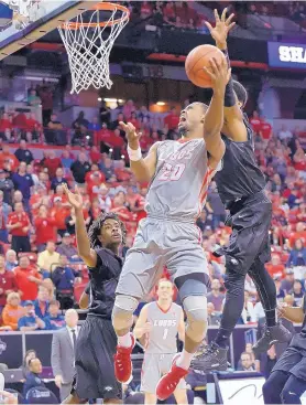  ?? DAVID BECKER/THE ASSOCIATED PRESS New Mexico’s Sam Logwood (20) shoots against Nevada during the second half of Thursday’s game. The Lobos lost 64-62 and now hope to play in the CBI. ??