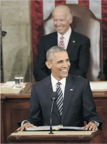  ?? SAUL LOEB/GETTY IMAGES ?? U.S. President Barack Obama looks on with Vice-President Joe Biden during the State of the Union Address in Washington on Tuesday night. The country must not allow fear and division to take hold, Obama said.