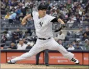  ?? BILL KOSTROUN — THE ASSOCIATED PRESS ?? New York Yankees starting pitcher Masahiro Tanaka delivers the ball to the Los Angeles Angels during the second inning of a baseball game Sunday at Yankee Stadium in New York.