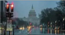  ?? J. SCOTT APPLEWHITE — THE ASSOCIATED PRESS ?? The Capitol is seen on a rainy morning in Washington, Friday during a partial government shutdown.