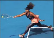  ?? Matt King / Getty Images ?? Naomi Osaka of Japan plays a forehand in her women’s singles quarterfin­al match against Su-Wei Hsieh of Chinese Taipei at the Australian Open at Melbourne Park on Tuesday in Melbourne, Australia.
