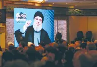  ?? (Reuters) ?? HEZBOLLAH LEADER Hassan Nasrallah address supporters by video on the terrorist organizati­on’s annual leaders’ day last Thursday.