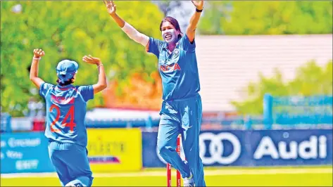  ??  ?? Jhulan Goswami picking up her 200th ODI wicket , the first woman to reach the landmark.