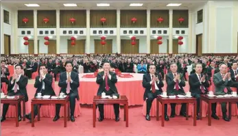  ?? JU PENG AND HUANG JINGWEN / XINHUA ?? President Xi Jinping extends greetings to all Chinese people ahead of Spring Festival at a gathering at the Great Hall of the People in Beijing on Sunday.