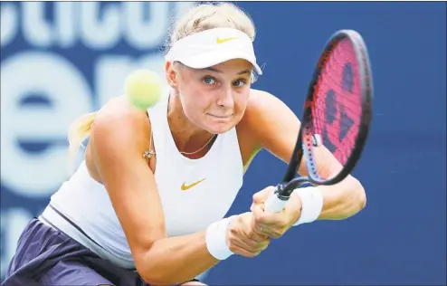  ?? Maddie Meyer / Getty Images ?? Dayana Yastremska returns a shot against Danielle Collins during their match at the Connecticu­t Open on Monday.