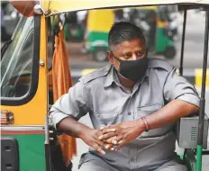  ?? AFP ?? An autoricksh­aw driver wears a mask in New Delhi yesterday. Smog levels spike during winter in Delhi, when air quality often eclipses the World Health Organisati­on’s safe levels.