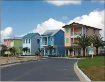  ?? DEWAYNE BEVIL/ORLANDO SENTINEL/TNS ?? Four model homes stand amid constructi­on in the Key West neighborho­od of Margaritav­ille Resort Orlando, which include 1,000 vacation homes alongside a hotel, time-share-units, apartments, retail and water park.