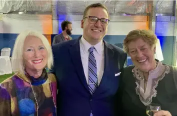  ?? Patricia Sheridan/Post-Gazette photos ?? Barbara Lovejoy, left, Trevor Day and Sue Hunter at The Neighborho­od Academy benefit Wednesday in Stanton Heights.