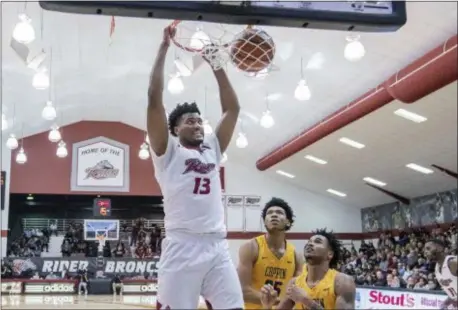  ?? JOHN BLAINE — FOR THE TRENTONIAN ?? Rider’s Frederick Scott (13) dunks the ball against Coppin State during the first half of Monday night’s game at Alumni Gymnasium.