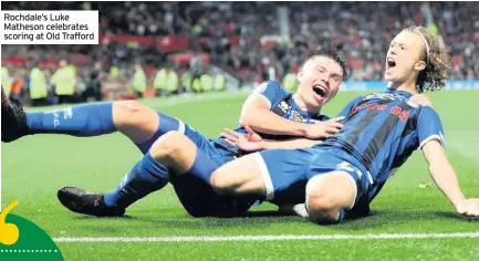  ??  ?? Rochdale’s Luke Matheson celebrates scoring at Old Trafford