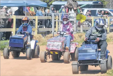  ?? MITCH MACDONALD/THE GUARDIAN ?? Young drivers make their way around Grassroots Raceway in Morell during a race hosted by the P.E.I. Lawn Tractor Racing Club. Last Sunday saw the final lawn tractor racing event for the season with all of the year’s proceeds going towards the P.E.I. Children’s Wish Foundation.