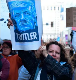  ?? AFP ?? Activists protest outside a hotel in Philadelph­ia as US President Donald Trump attends the Congress of Tomorrow Republican Member Retreat. —