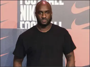  ?? VIANNEY LE CAER/AP PHOTO ?? Virgil Abloh poses for photograph­ers upon arrival at the Nike Celebrates The Beautiful Game event, in London, Feb. 7, 2018. Abloh, a leading fashion executive hailed as the Karl Lagerfeld of his generation, has died after a private battle with cancer. He was 41. Abloh’s death was announced, Sunday, by LVMH Louis Vuitton and the Off White label, the brand he founded.
