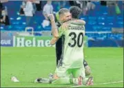  ?? AFP ?? Sheriff's midfielder Dimitrios Kolovos and goalkeeper Giorgos Athanasiad­is celebrate their win against Real.