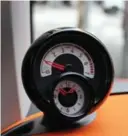  ??  ?? This funky tachometer/clock perches atop the 2016 Smart’s dash.