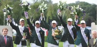  ??  ?? The Irish team, 2012 Nations cup winners, are presented with the Edward, prince of wales cup