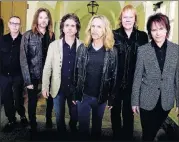  ??  ?? Styx’s Tommy Shaw, third from right, says the band worked on its new album, “The Mission,” for about two years during about 300 dates on tour.