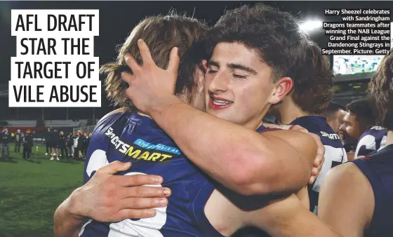  ?? Picture: Getty ?? Harry Sheezel celebrates with Sandringha­m Dragons teammates after winning the NAB League Grand Final against the Dandenong Stingrays in September.