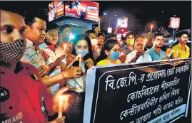  ?? AFP ?? A candleligh­t march being held to protest against the polling day deaths in Siliguri on Saturday.