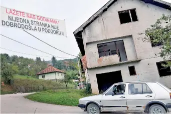  ??  ?? The anti-politician banner reads “You've been lying to us for years! None of the political parties is welcome in Podgora!” It is displayed across the main road in the small Central-Bosnian village of Podgora on the eve of Bosnian elections. AFP