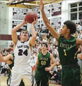  ?? DANA JENSEN/THE DAY ?? East Lyme’s Luke Leonard (24) goes up and draws a foul on Enfield’s Jadon Archer (1) during Saturday night’s CIAC Division III quarterfin­al game at East Lyme. No. 5 Enfield beat the No. 4 Vikings 90-77.