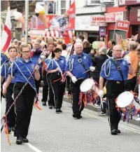  ??  ?? The Orange Lodge parade past the Cenotaph in Southport on a previous march