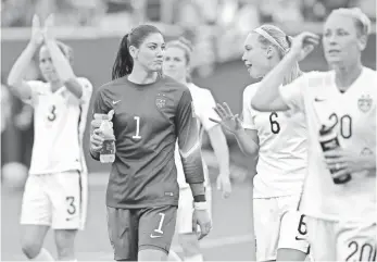  ?? BRUCE FEDYCK, USA TODAY SPORTS ?? Hope Solo (1), who made several key saves, walks off the field after the Americans’ 3-1 victory.